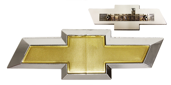 EMBLEMA LOGO DEL AVEO/SONIC 12-18 CROMO