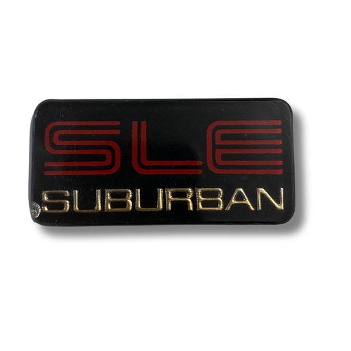 [EMB-0991-10] EMBLEMA LETRERO SLE CV SUBURBAN OVAL ENC JG